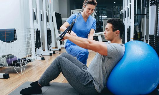 physical therapist working with patient